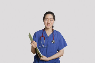 female nurse holding a clipboard